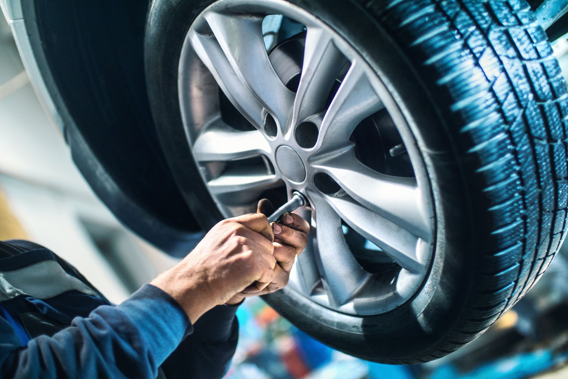 Replacing car wheel and tyre.